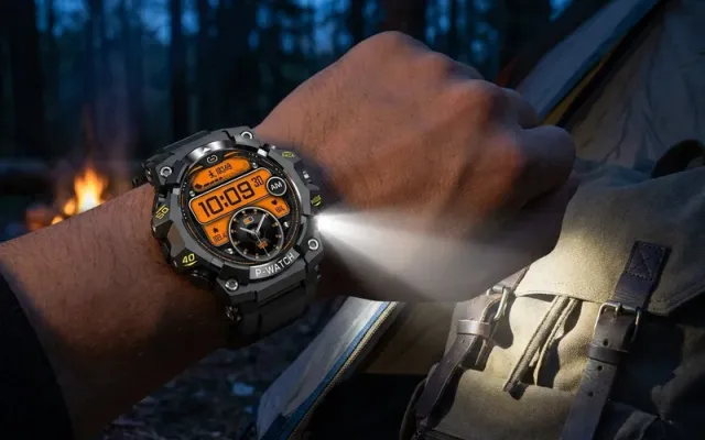 Vantrek X1 smartwatch built-in LED flashlight lighting up a backpack at a campsite at night